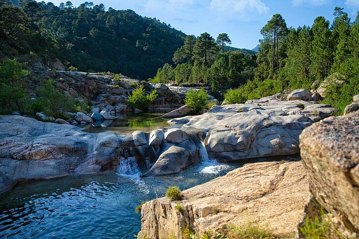 Scenery of the Natural Pools of the Cavu in Sainte-Lucie de Porto-Vecchio, an ideal spot for a refreshing hike in the heart of the Corsican maquis.