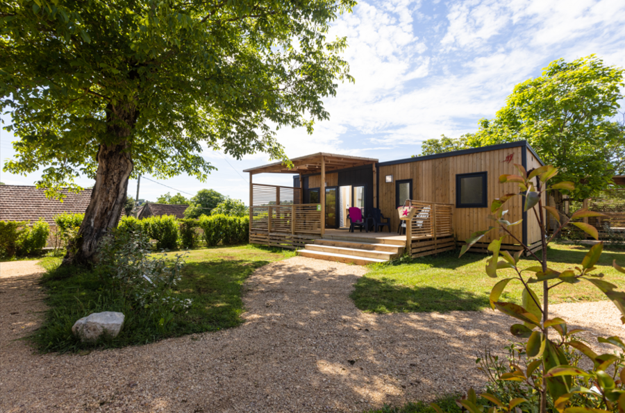 Modern Wooden Mobile Home with Terrace and Lush Garden