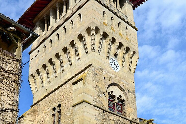 The Maison Romane Low-angle view of the Maison Romane’s bell tower in Saint-Antonin-Noble-Val, featuring its clock and stone arches.