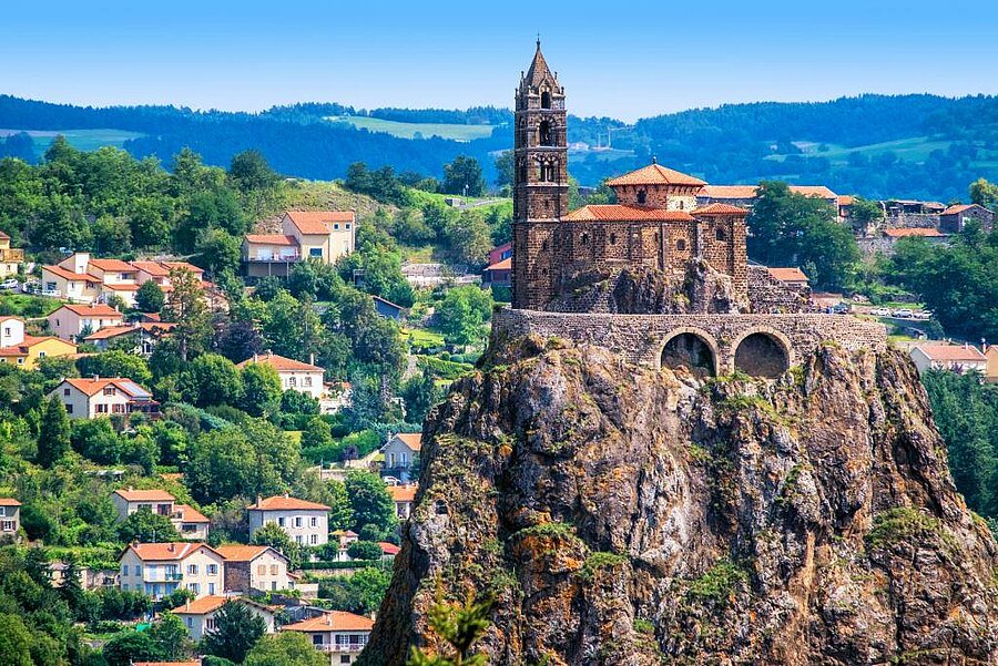 Saint-Michel rock and chapel above the rooftops of Le Puy en Velay, near the campsite