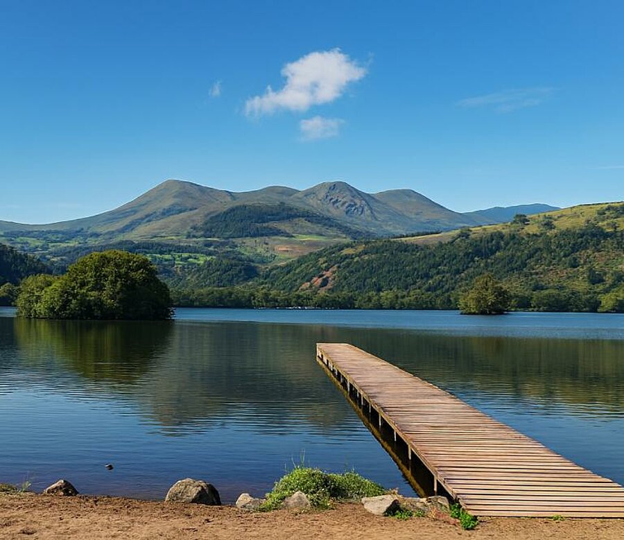Lake view at Chambon with its jetty and stunning mountains.