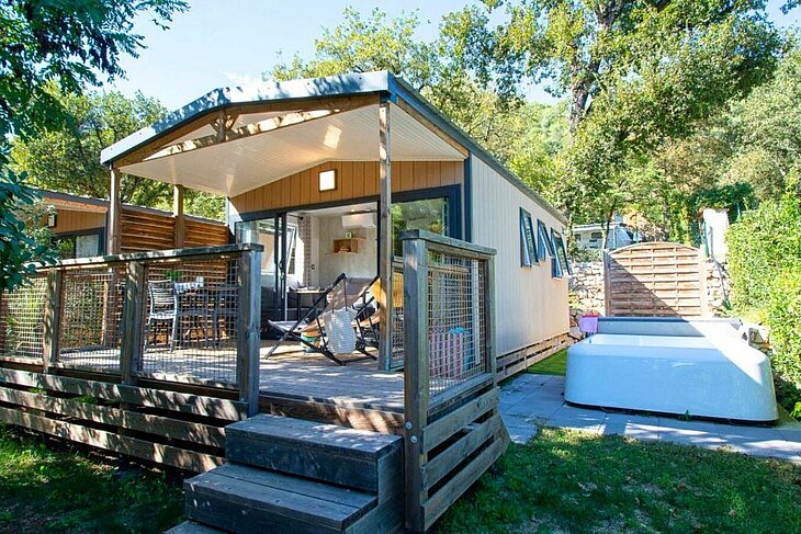 Comfortable mobile home with a shaded terrace in a nature campsite at La Colle-sur-Loup, perfect for a relaxing holiday after exploring what to do in La Colle-sur-Loup.