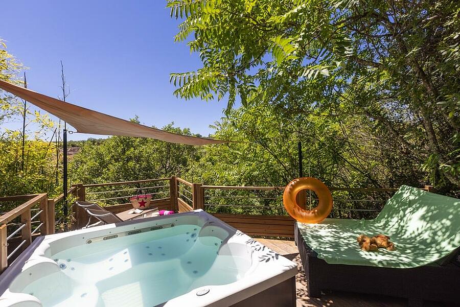Exterior view of a rental with spa and relaxation area