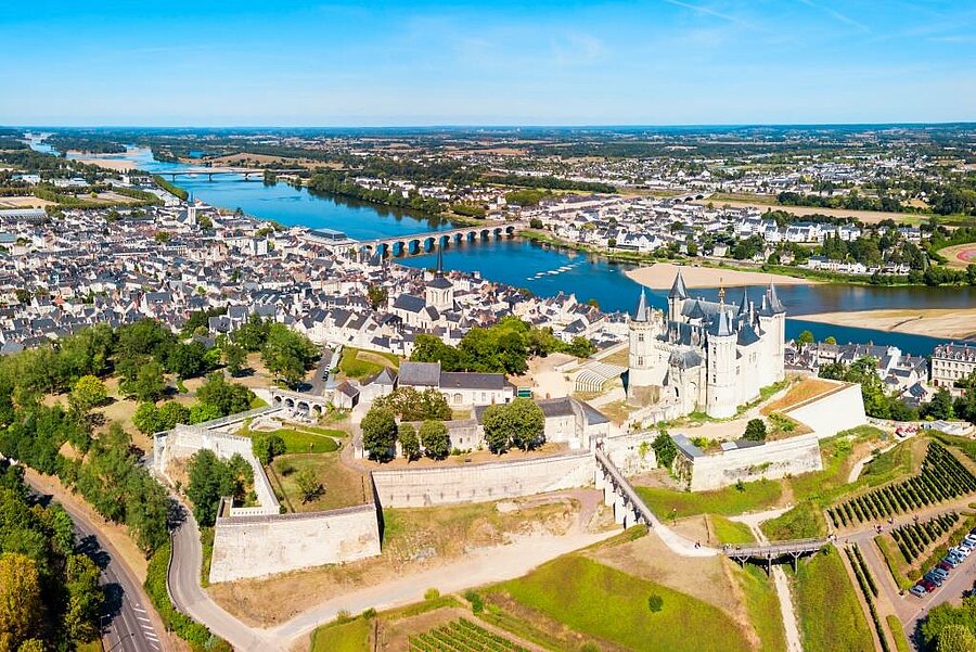 Aerial view of Saumur with its castle overlooking the Loire River, a historic town to explore during a Camping Saumur stay.