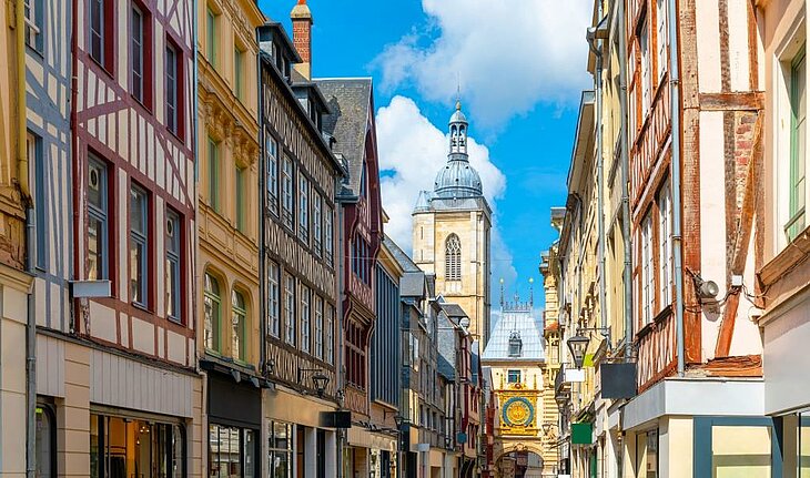 Colourful half-timbered houses in the historic centre of Rouen, Normandy, a lively street leading to the Gros-Horloge, a charming solo visit.