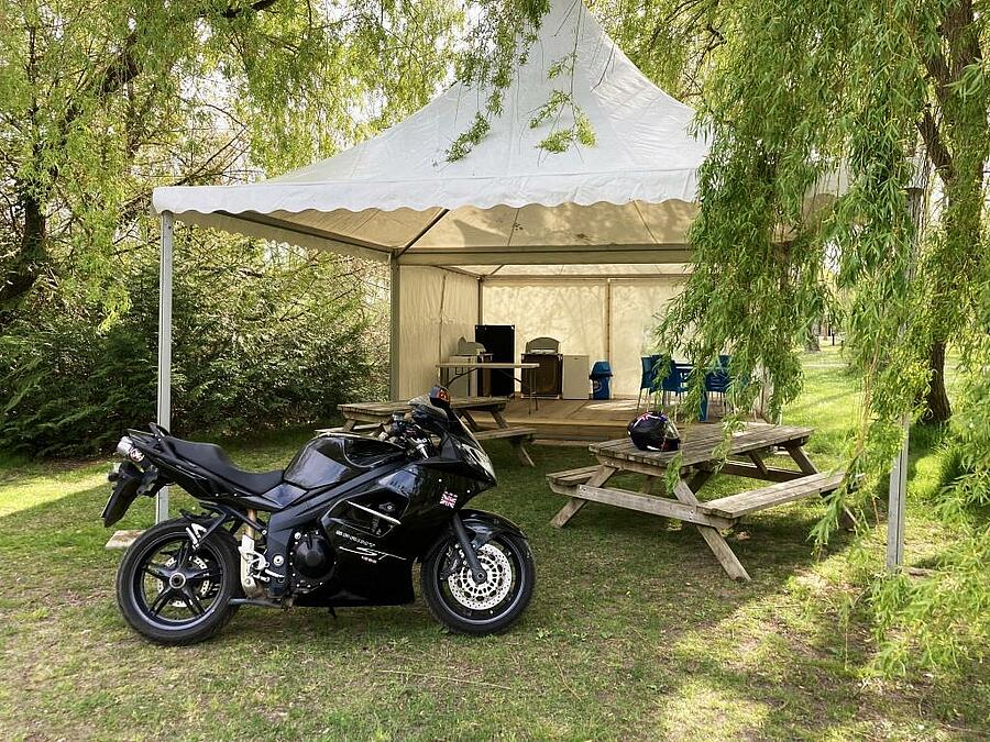 Biker area with picnic tables and kitchen corner