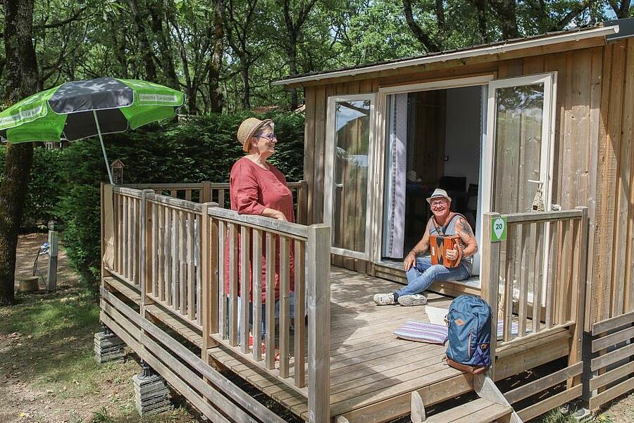 Senior couple enjoying a terrace in nature camping