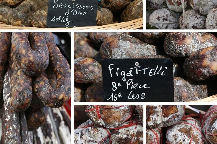 Corsican charcuterie in Sainte-Lucie de Porto-Vecchio, with figatelli and artisanal sausages — a must-try treat to savour authentic local flavours.