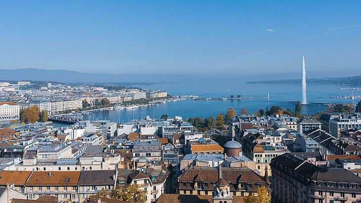 Panoramic view of Geneva and Lake Geneva with its famous water jet, an iconic destination near Haute-Savoie in Auvergne-Rhône-Alpes, where city meets nature