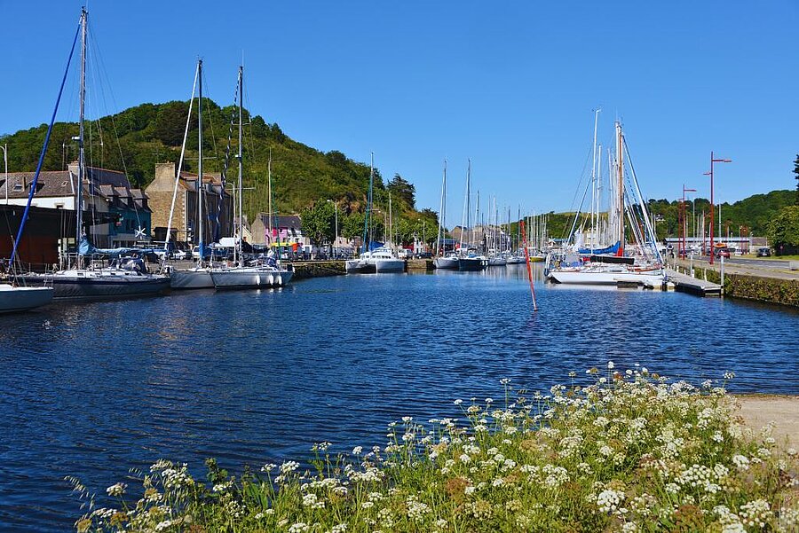 Saint-Brieuc marina with sailing boats and lively quays, a great place to explore while staying at a campsite near the city.