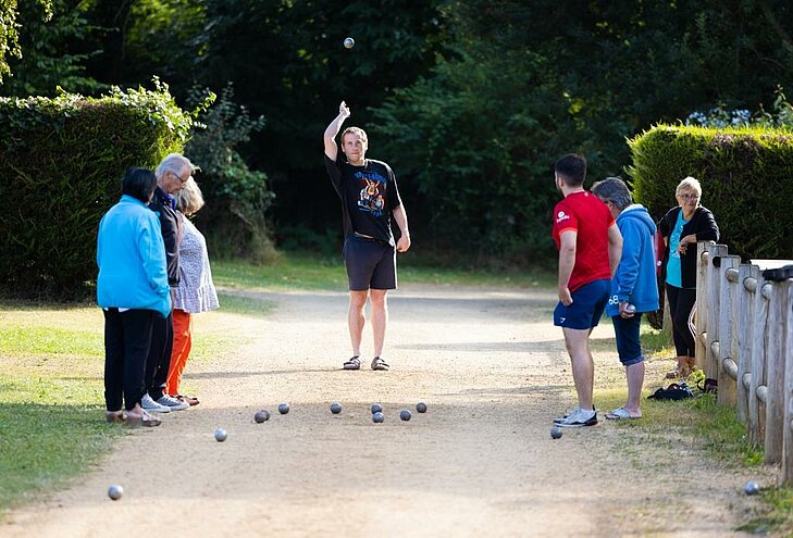 Friendly pétanque game in Lanloup Friendly pétanque game in Lanloup, showcasing local cultural events rooted in the village’s heritage.