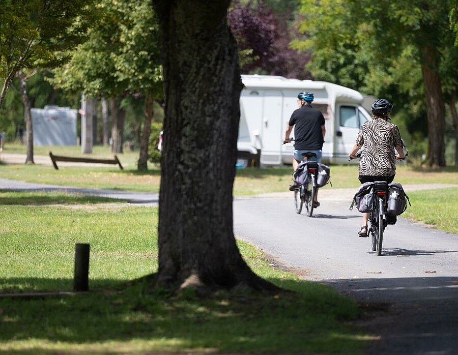Two cycle tourists in a Loire Valley campsite, ready to explore the Loire à Vélo route