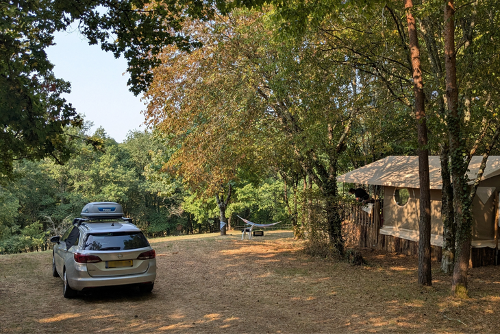La Grande Veyière Campsite in the Heart of the Dordogne Forest Car and lodge tent on a spacious, wooded pitch at La Grande Veyière campsite in the Dordogne.