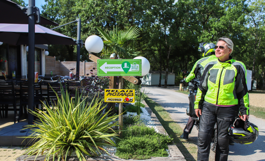 Couple of bikers arriving at a Relais Motards campsite