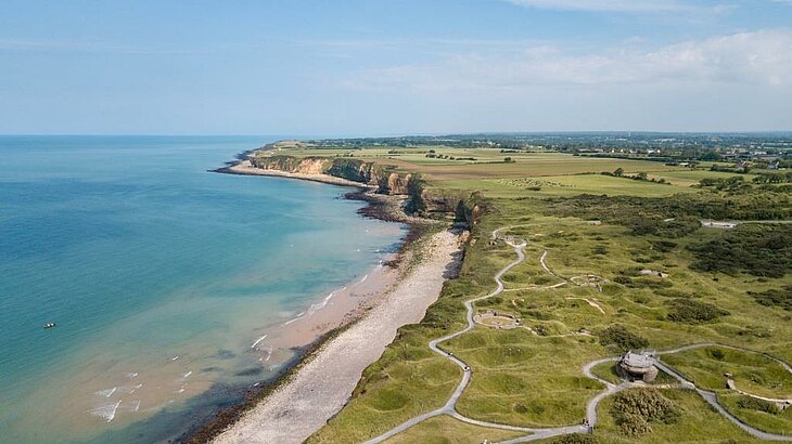 Aerial view of the D-Day beaches in Normandy, cliffs and remnants of the Atlantic Wall, a cultural family outing.
